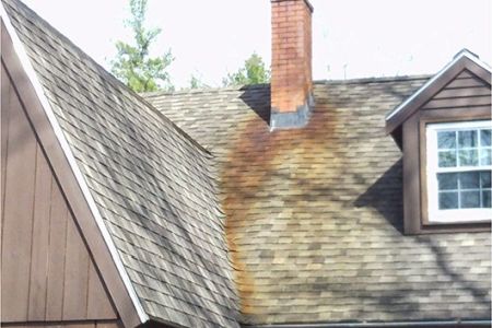 Home roof with rust stains - New Hampshire Pressure Washing